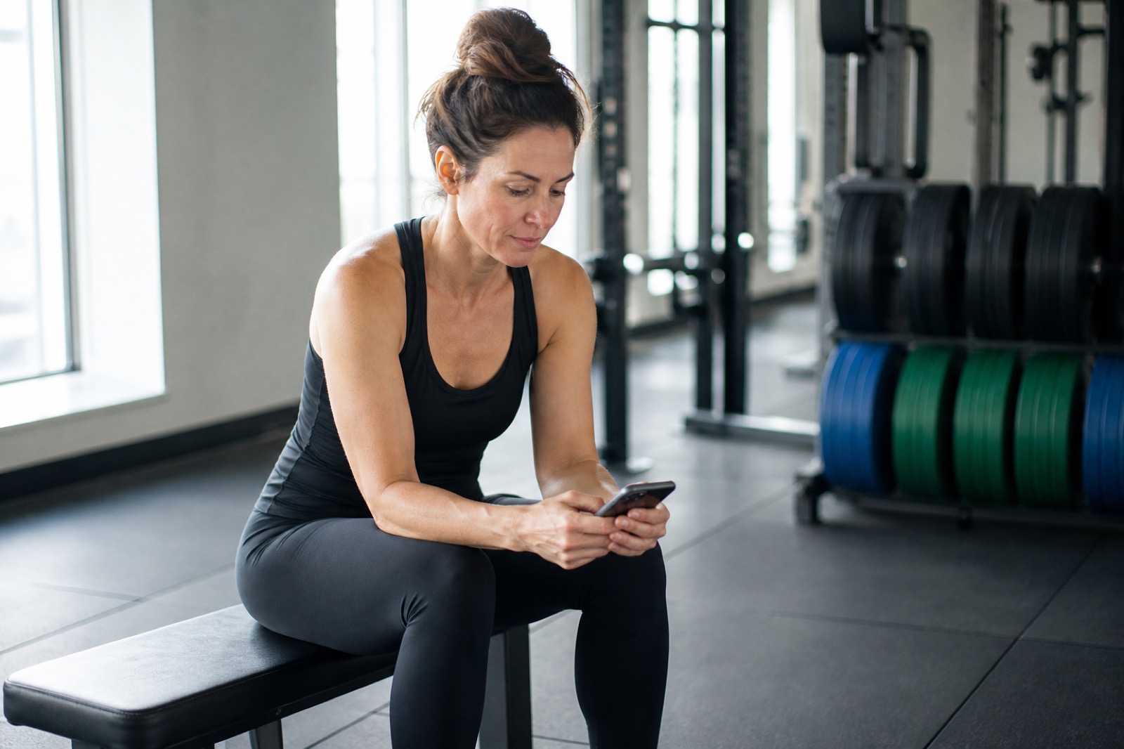 A woman completing the intake on her phone at home